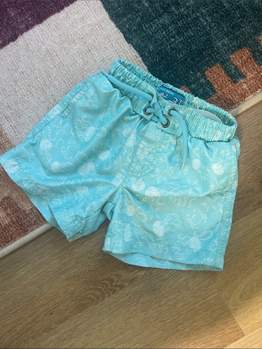Light Aqua Kids Swim Trunks with Sea Print